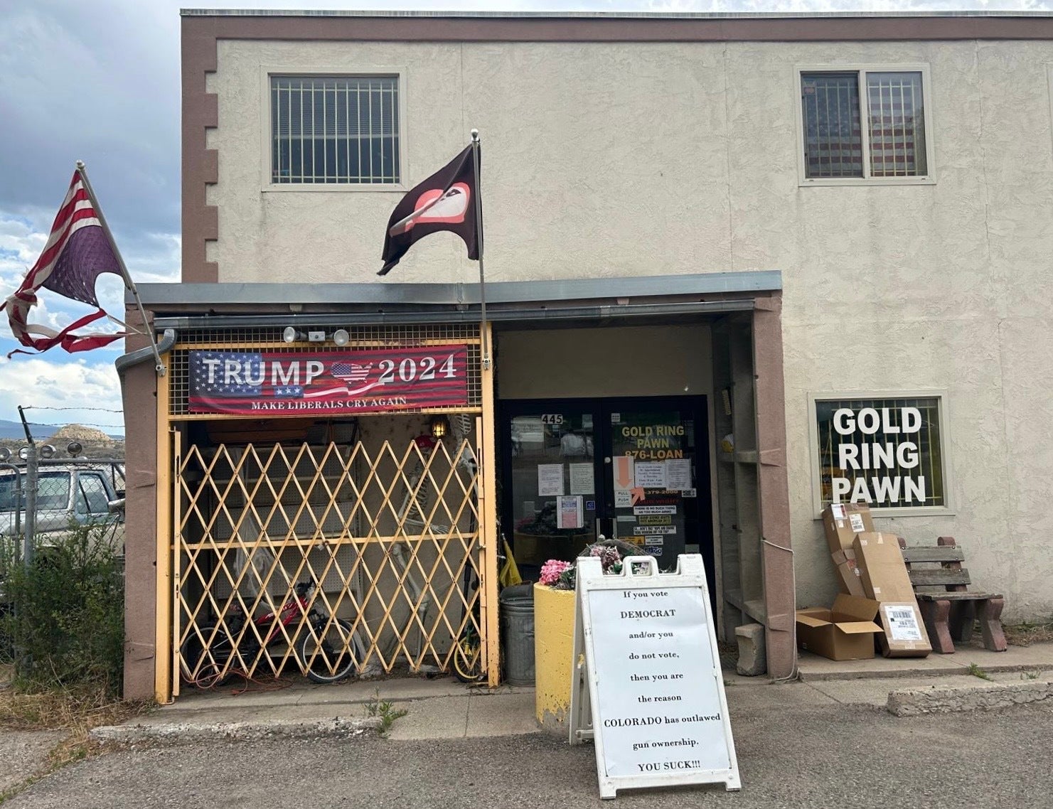 Outside of Garfield County Republican Doug Wight’s pawn shop in Stilt, Colorado sits a sign aimed at local Democrats and those who don’t vote